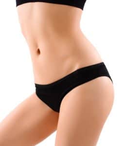 Woman wearing a black bra and underwear with a flat abdomen