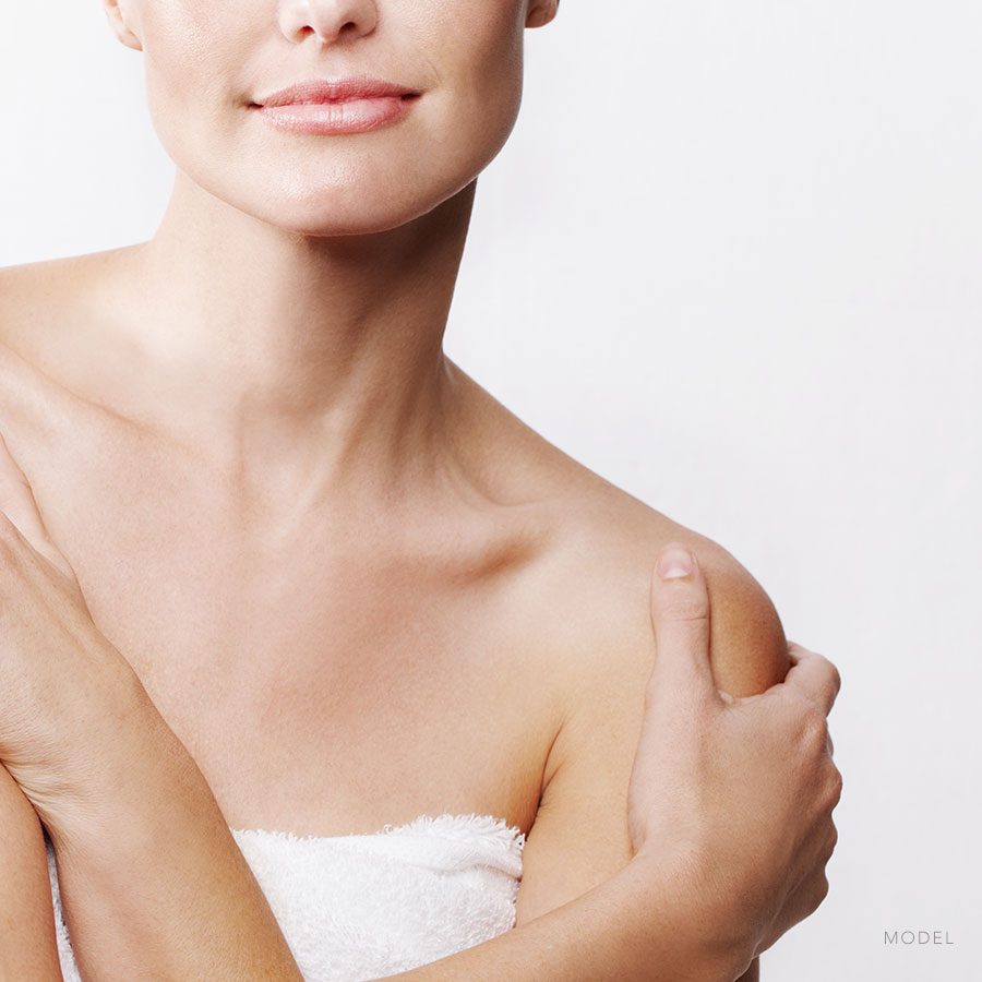 Model: woman crossing her arms over her chest